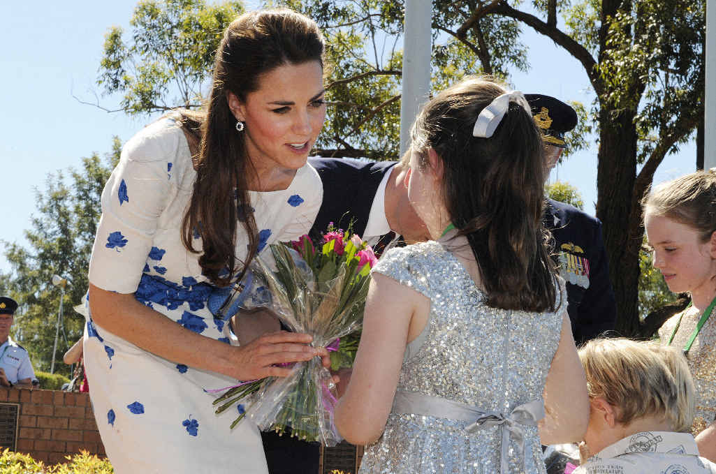 Children present flowers to the Duchess of Cambridge at Amberley Air Force base. Children present flowers to the Duchess of Cambridge at Amberley Air Force base.